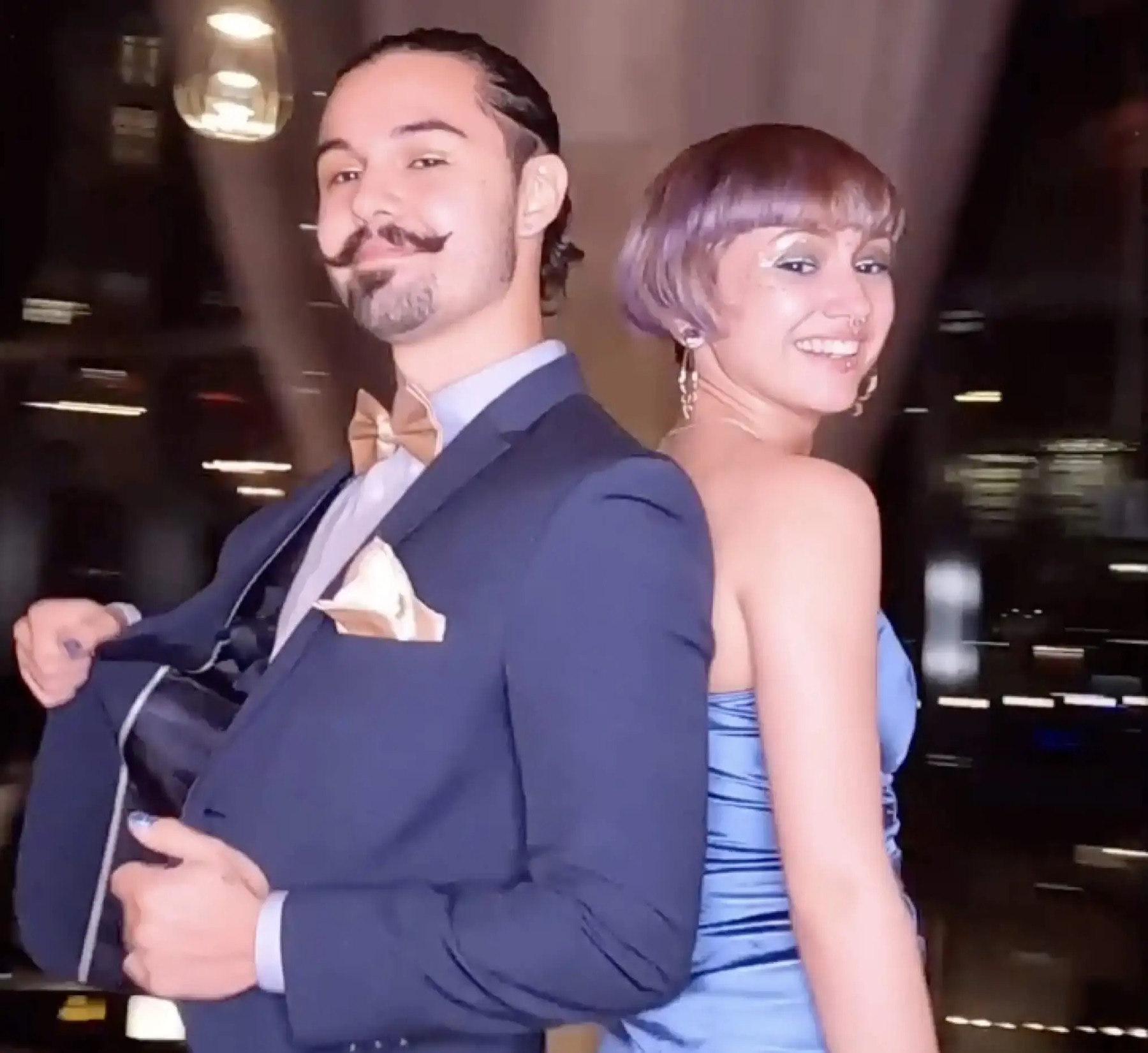 Two guests posing for the camera