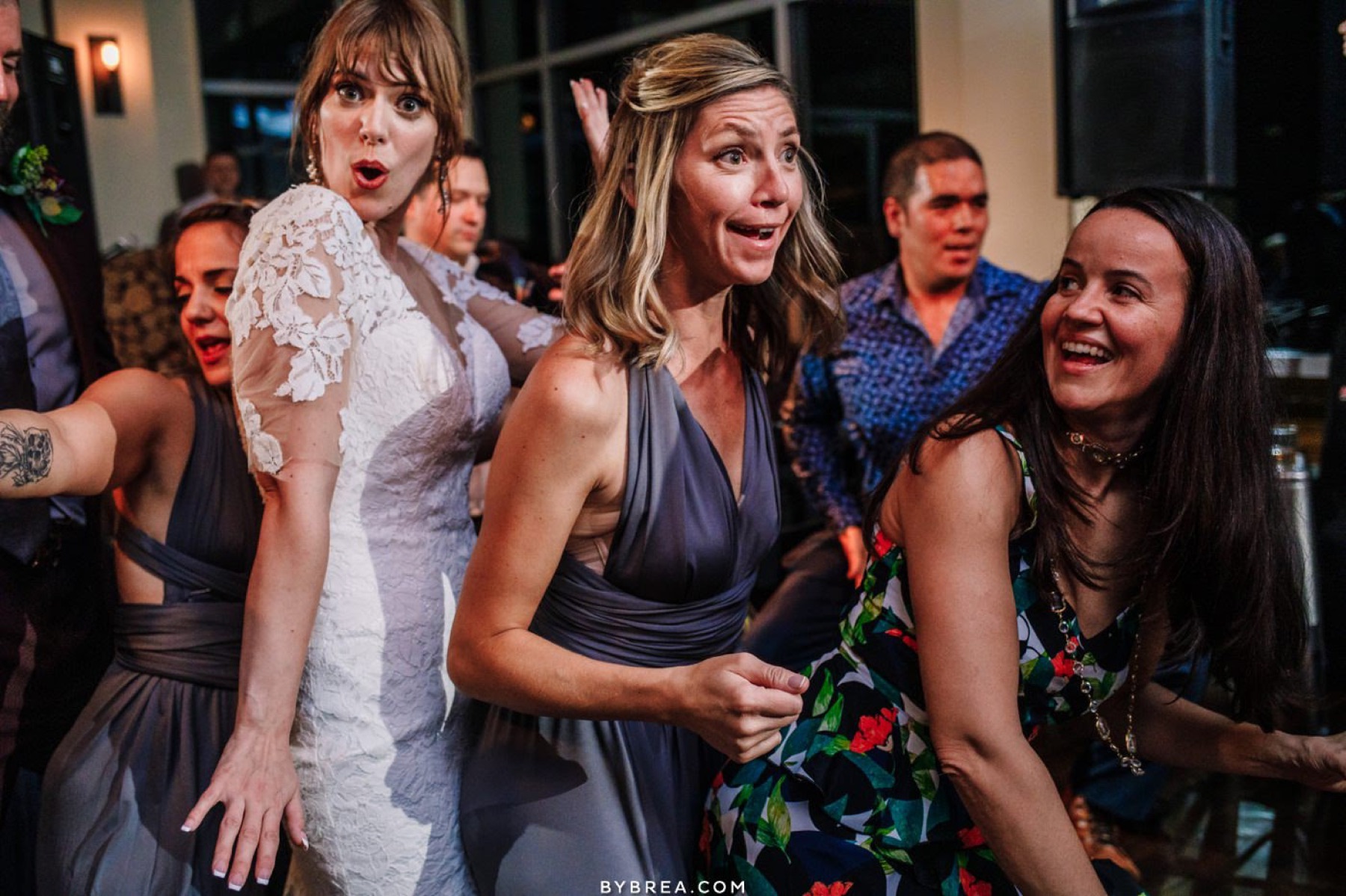 A bride and her bridesmaids on the dance floor