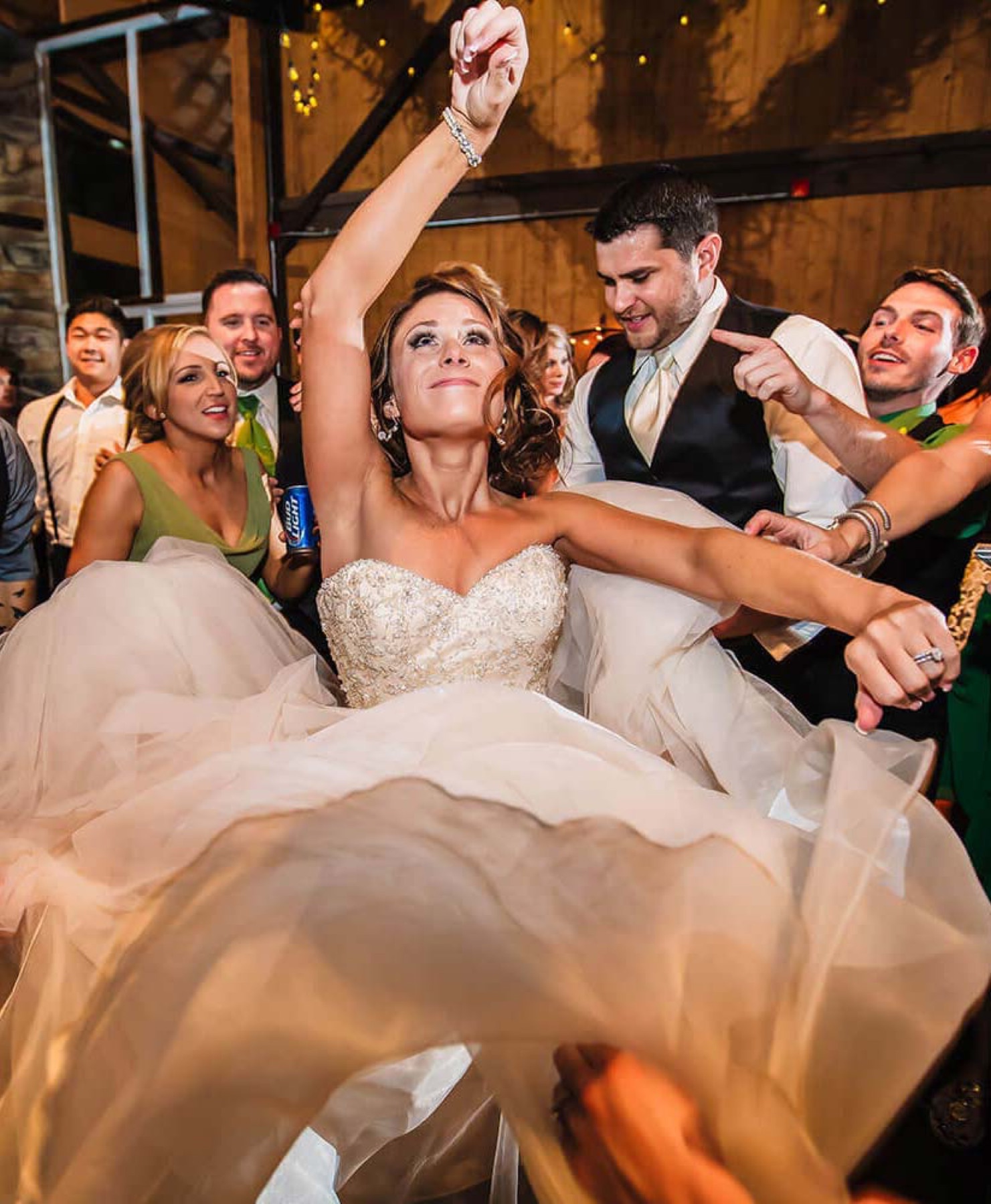 A bride dancing with her wedding party