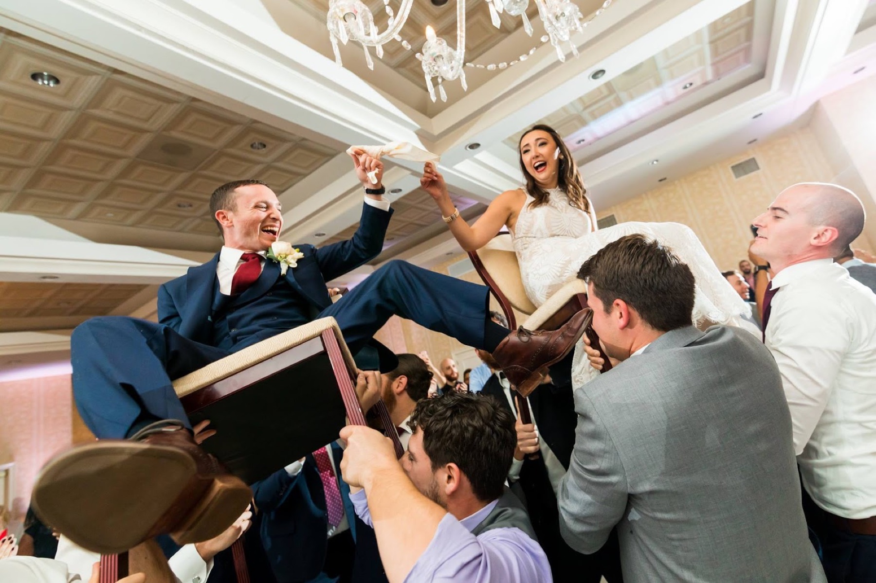 A couple lifted on chairs during the hora